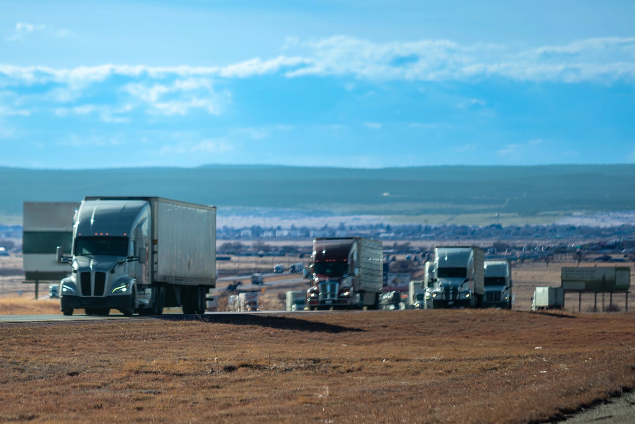 Lineup of commercial trucks representing varied transportation operations
