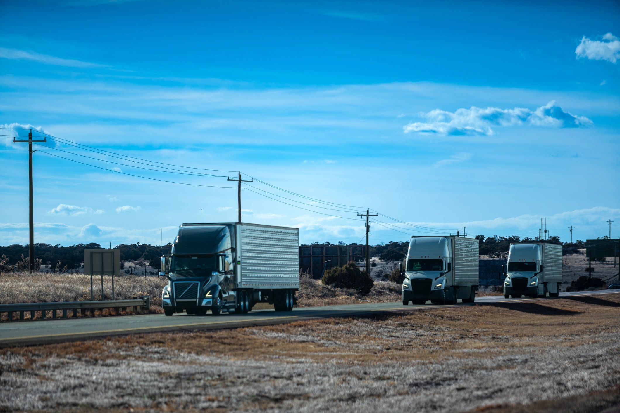 Commercial refrigerated truck fleet parked at a transportation facility